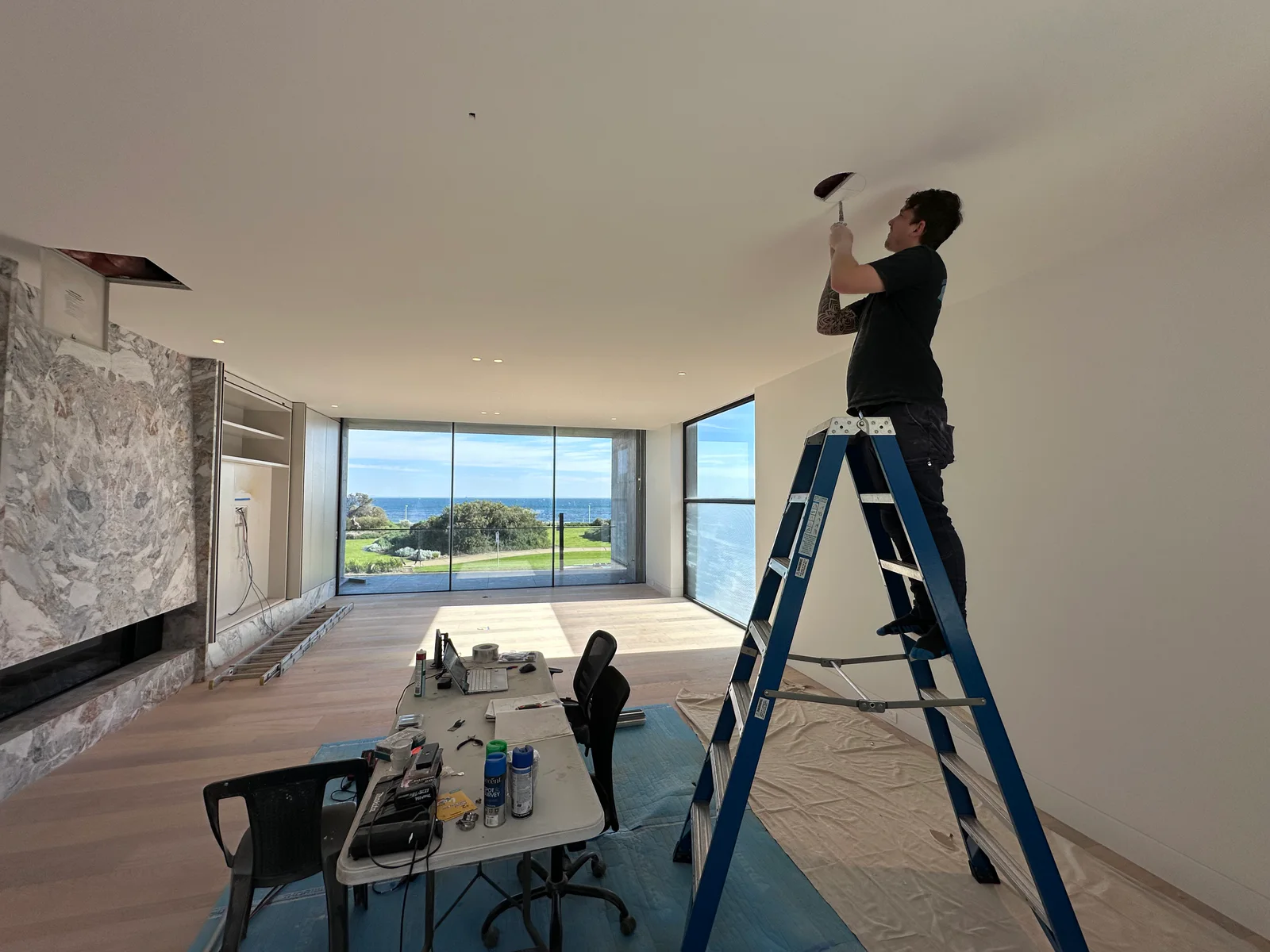 NorthTech technician working on ceiling equipment in a customer’s home