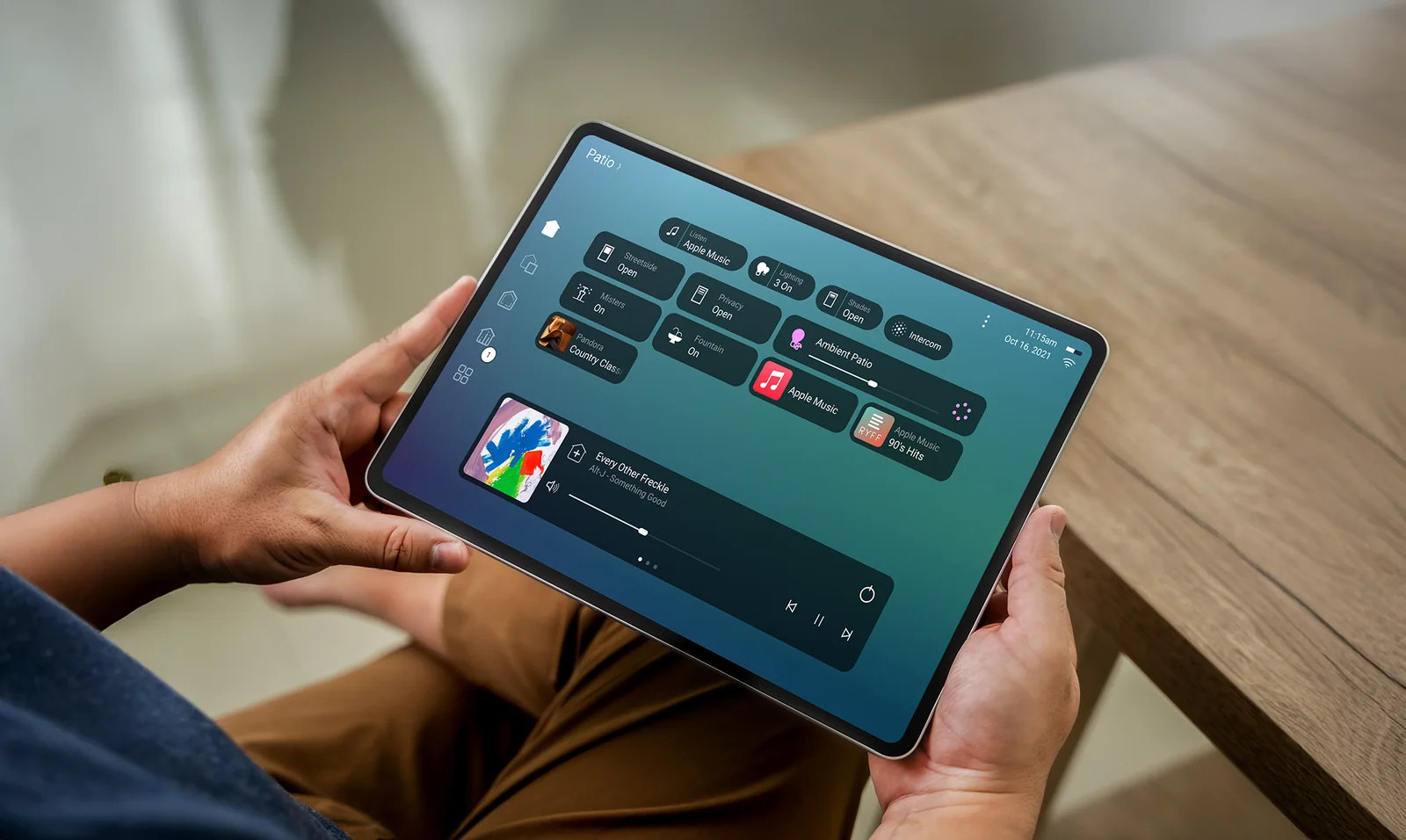Control4 X4 shown on a tablet being held