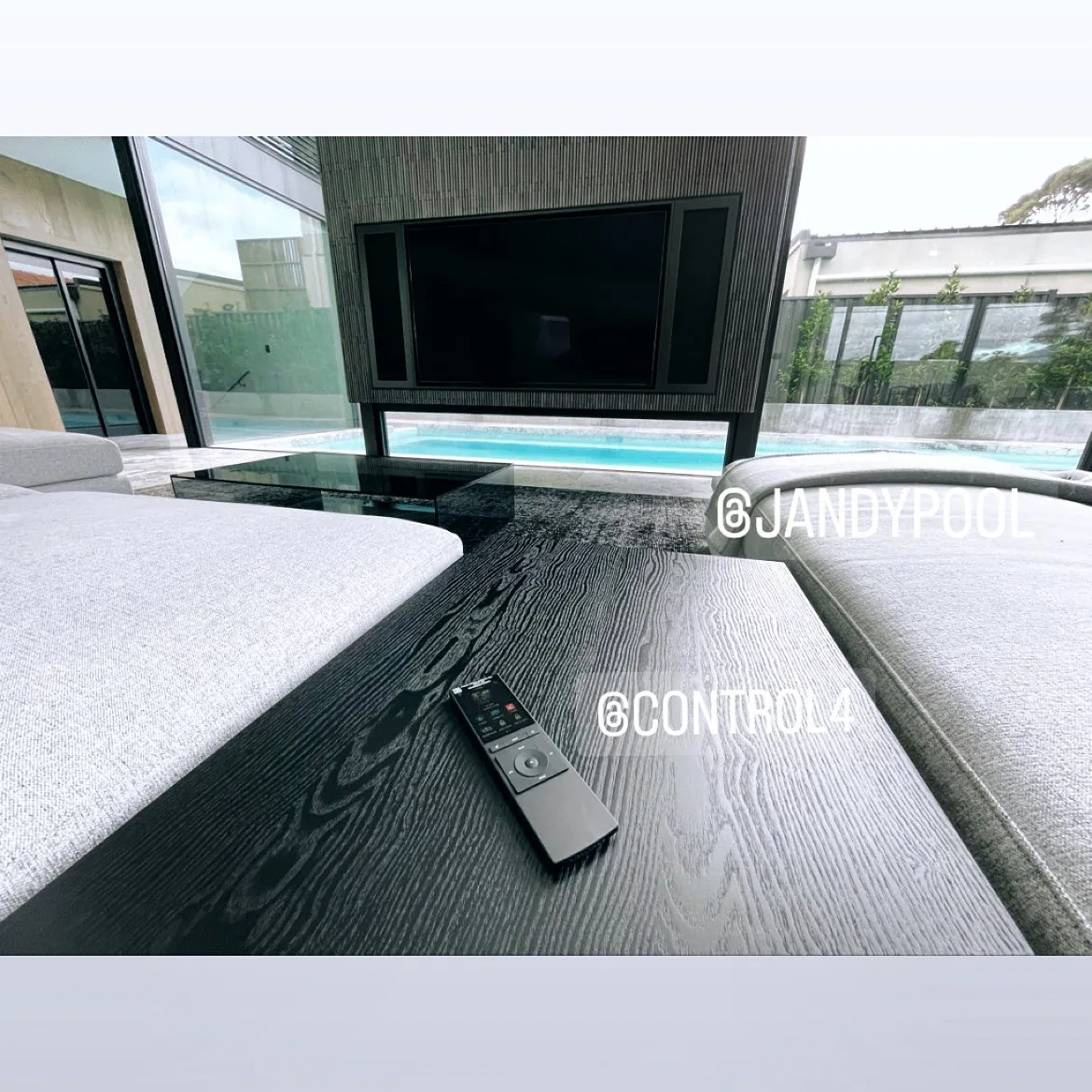 Outdoor television and Control4 remote in NorthTech's Essendon smart-home project
